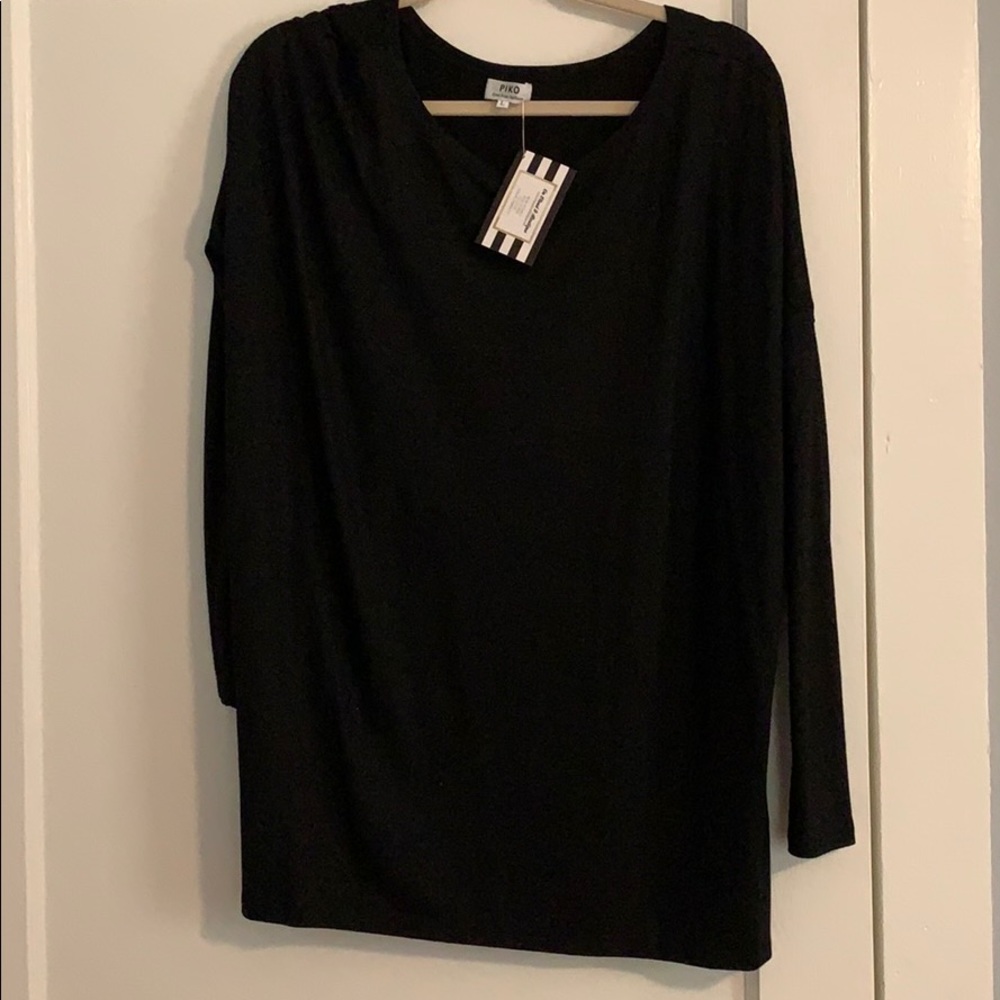 Large black piko shirt. Never worn.
